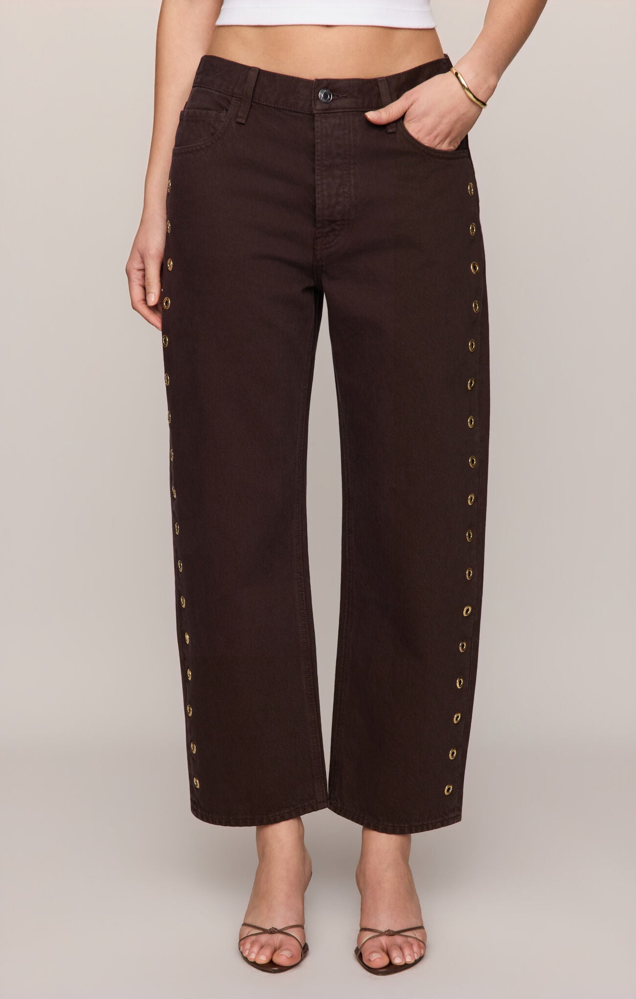 Brown bowed ankle jeans with grommets