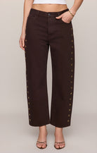 Brown bowed ankle jeans with grommets