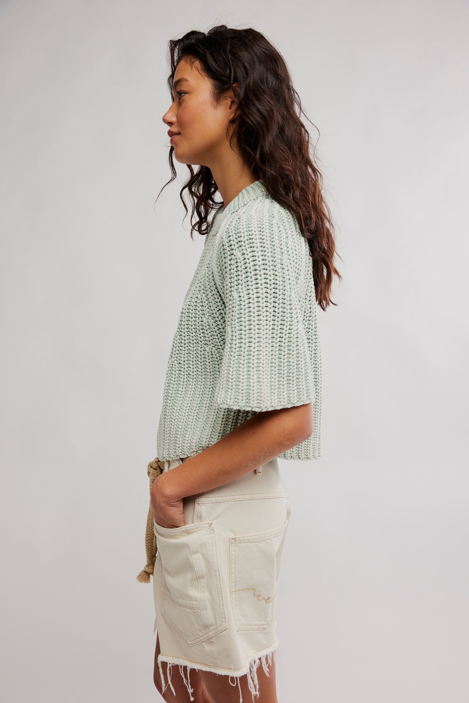 Side view of green sweater